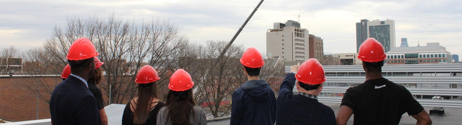 facilities management students observing construction.